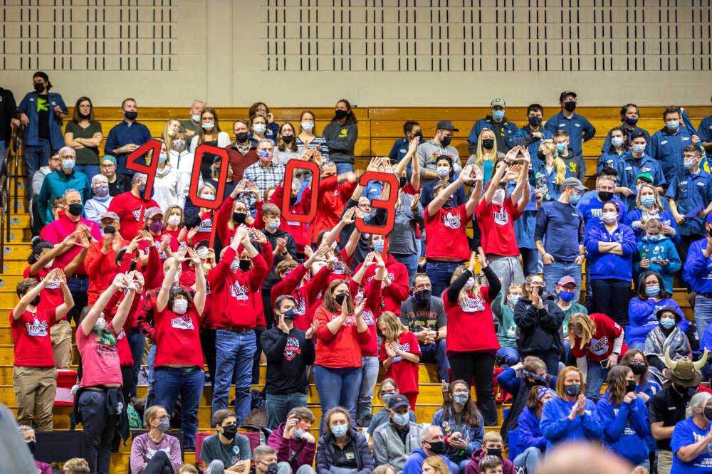A team in the stands cheer on their robot